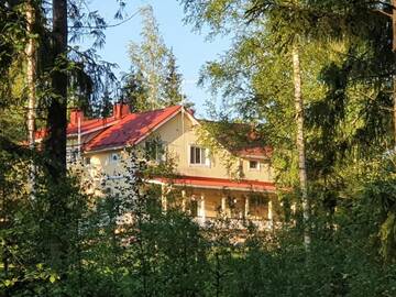 Фото Гостевой дом Tuhannen Tarinan Talo г. Каннускоски 1